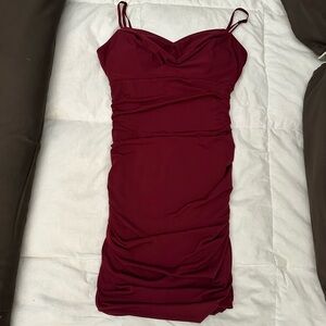 Great for Homecoming or Winter formal. This is a burgundy short dress, rooshing